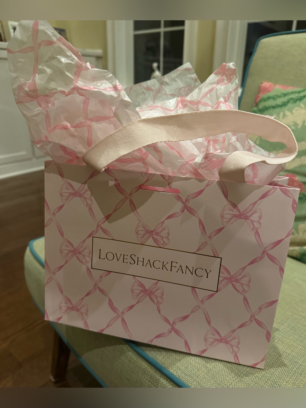 LoveShackFancy Pink Bow-Patterned Gift Bag with Pink Tissue.